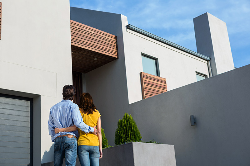 Family in front of house